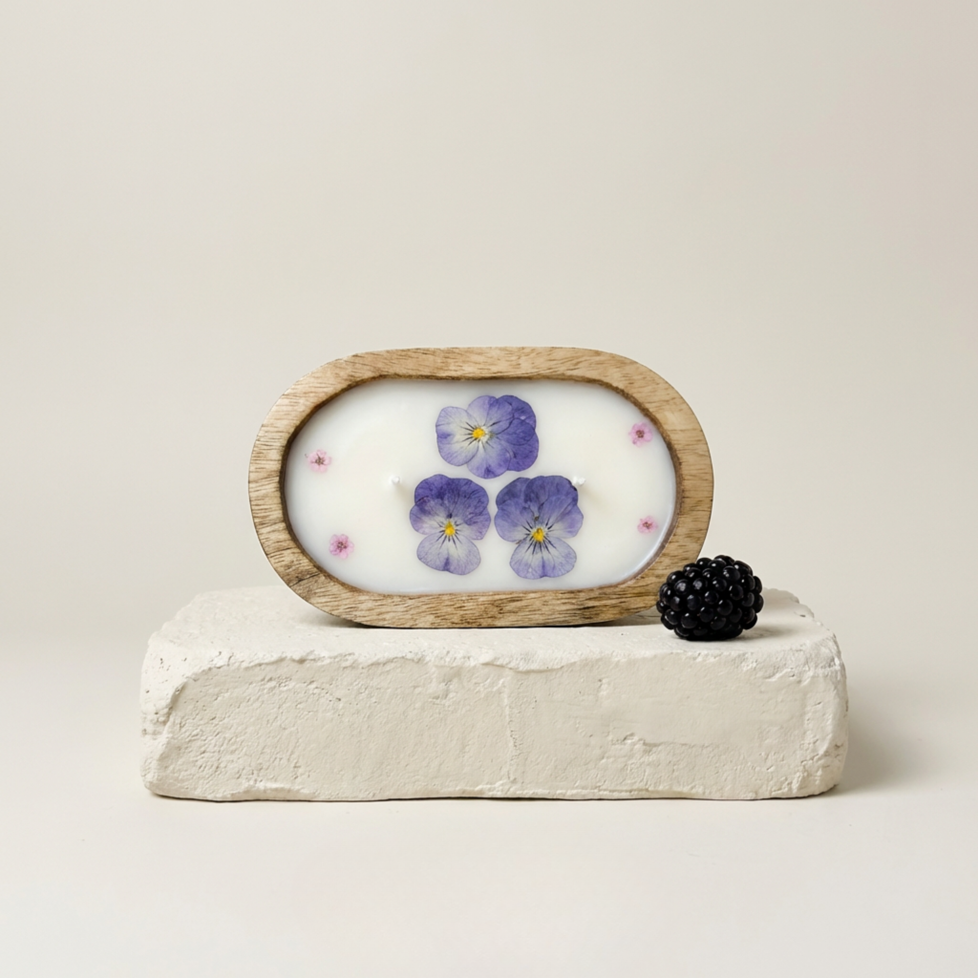 Decorative item with a wooden frame featuring floral design on a white background