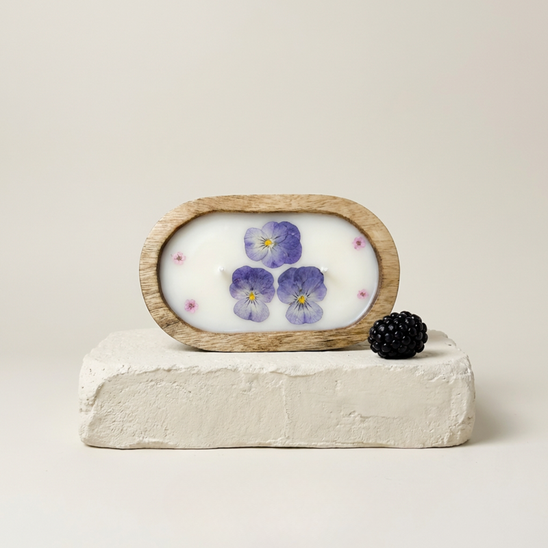 Decorative item with a wooden frame featuring floral design on a white background