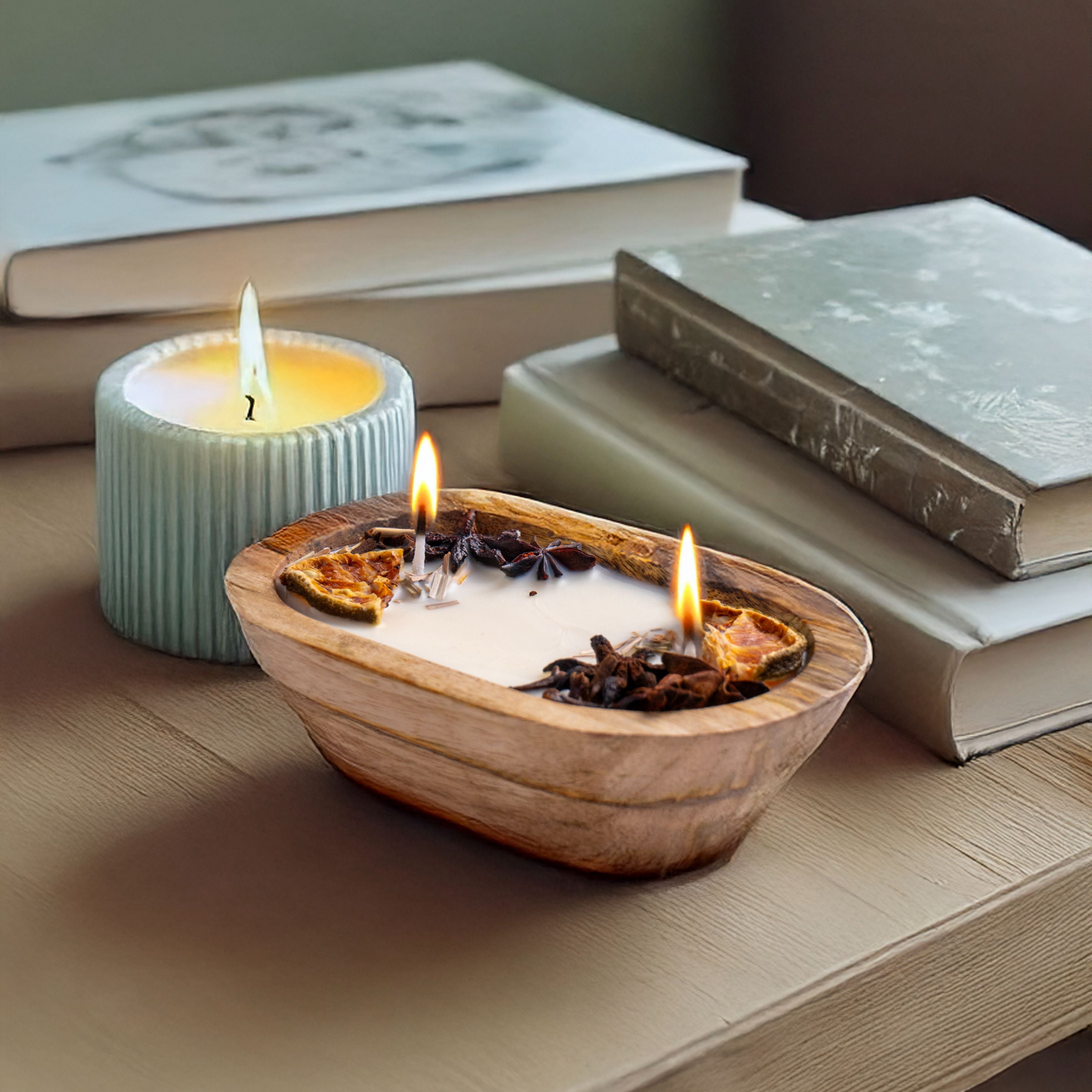 Candle in a wooden bowl with books in the background