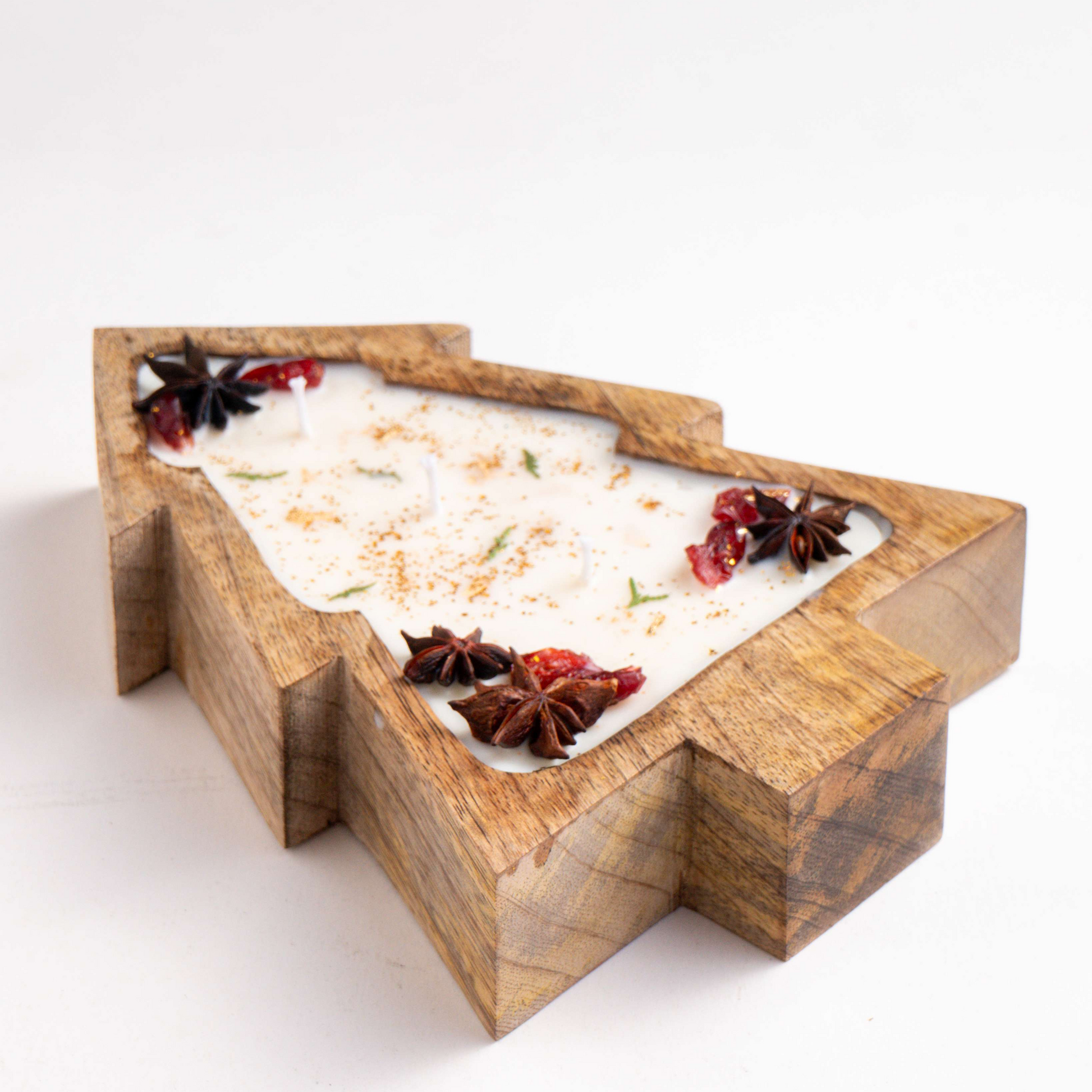 Wooden tray with a bath bomb and decorative elements on a white background