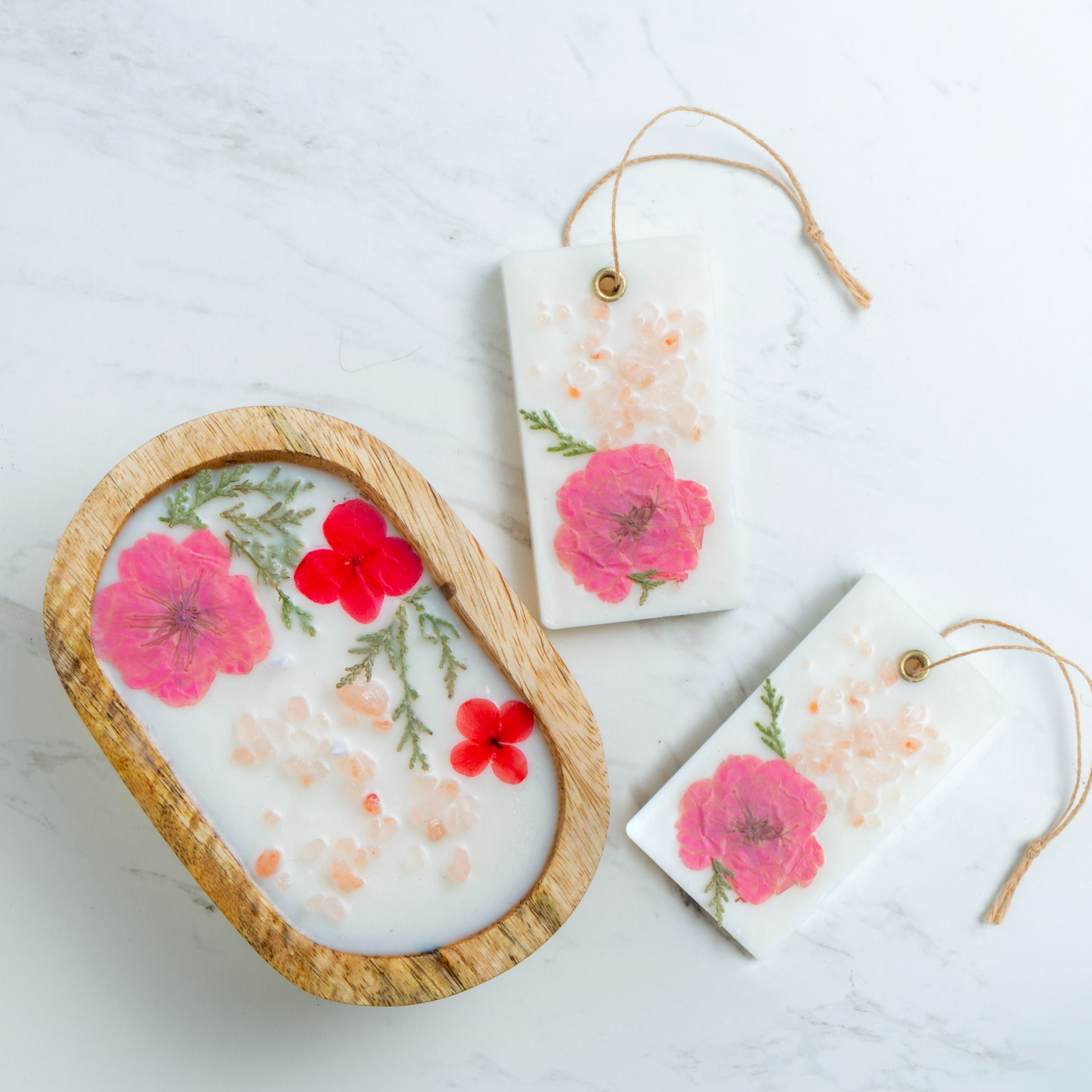 Decorative soaps with floral designs on a light surface