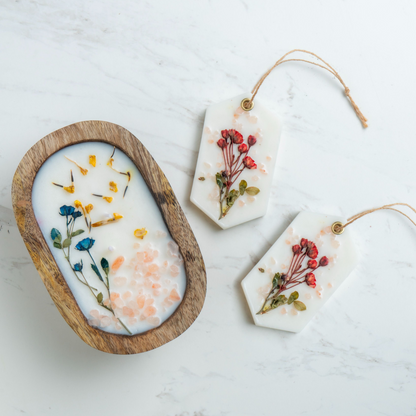 Decorative items with pressed flowers on a light background